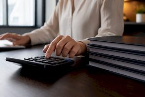 Bookkeeper calculating service fees